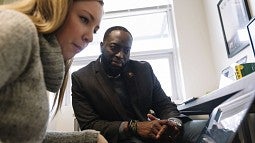 SOJC professor Troy Elias (right) and graduate student Dani Clarke 