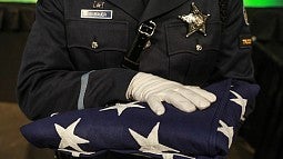 Oregon State Police Honor Guard presents the flag. Photo by Studio McDermott.