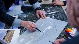 People at a drafting table