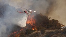 Helicopter dropping water