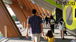 Chapa's son walks with his daughter in Hayward Field