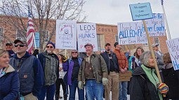 Crowd of protestors with signs supporting law enforcement