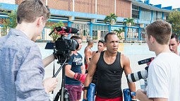 SOJC students interviewing Cuban boxers.