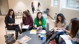 Journalism students gather in a dorm lounge