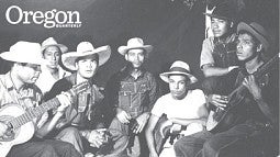 Farm workers playing guitars, circa 1942