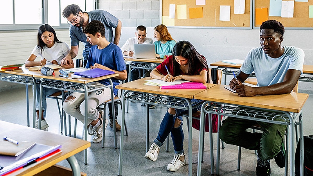 Teacher with students in classroom