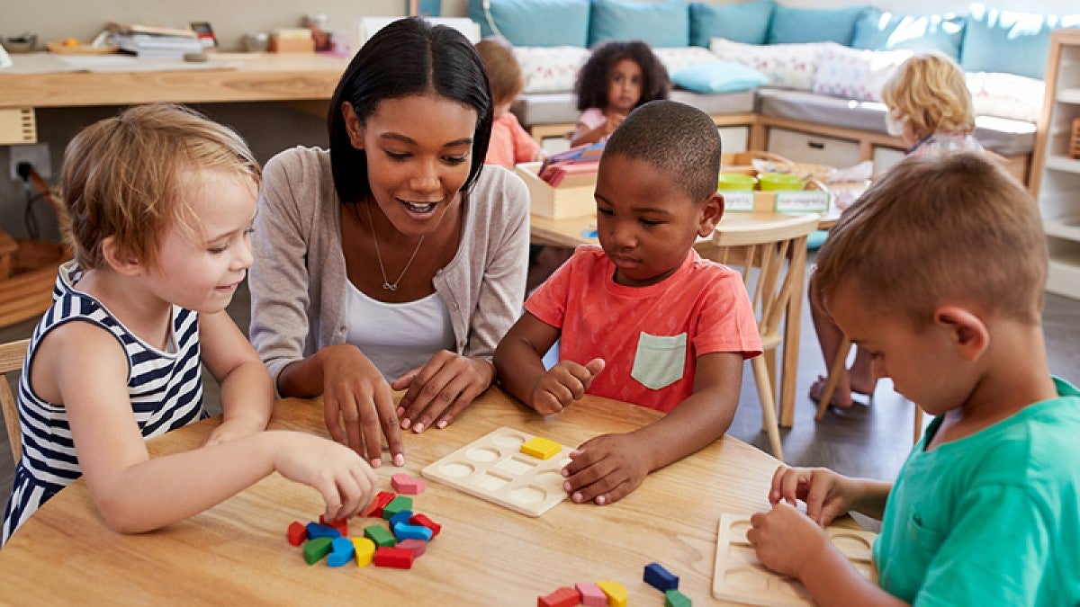 Preschool teacher with students