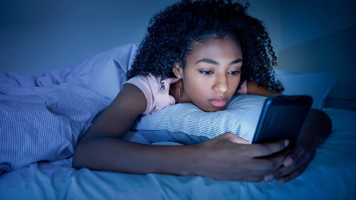 Teen girl using smartphone