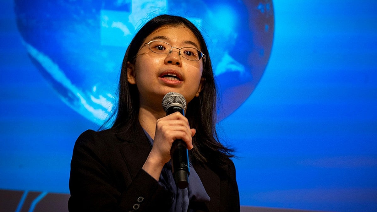 A student giving a Three Minute Thesis presentation