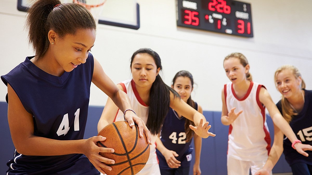 Young girls playing basketball