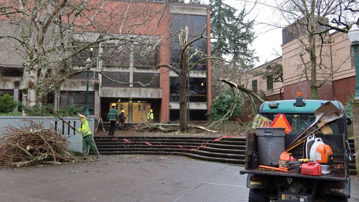 Facilities workers clean up debris at Gerlinger Annex