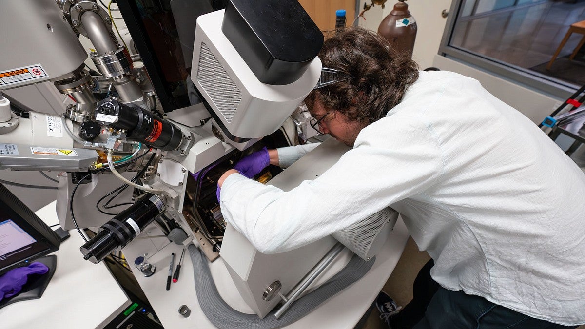 Reseacher working on lab equipment