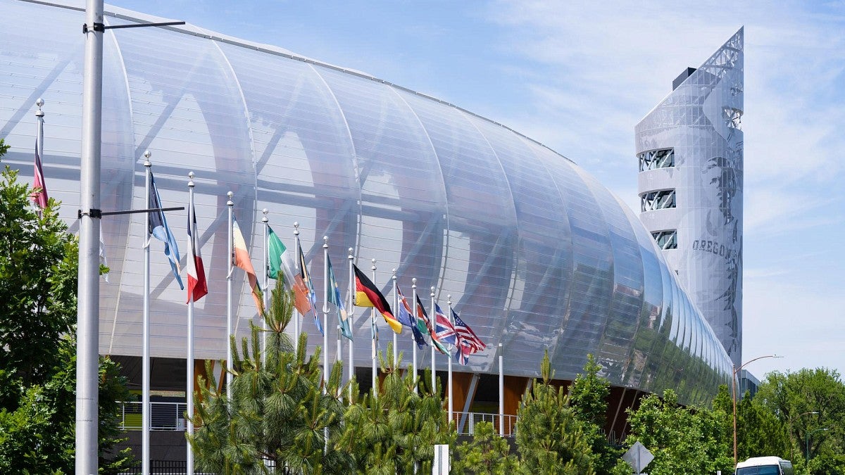 international flags fly beside Hayward Field