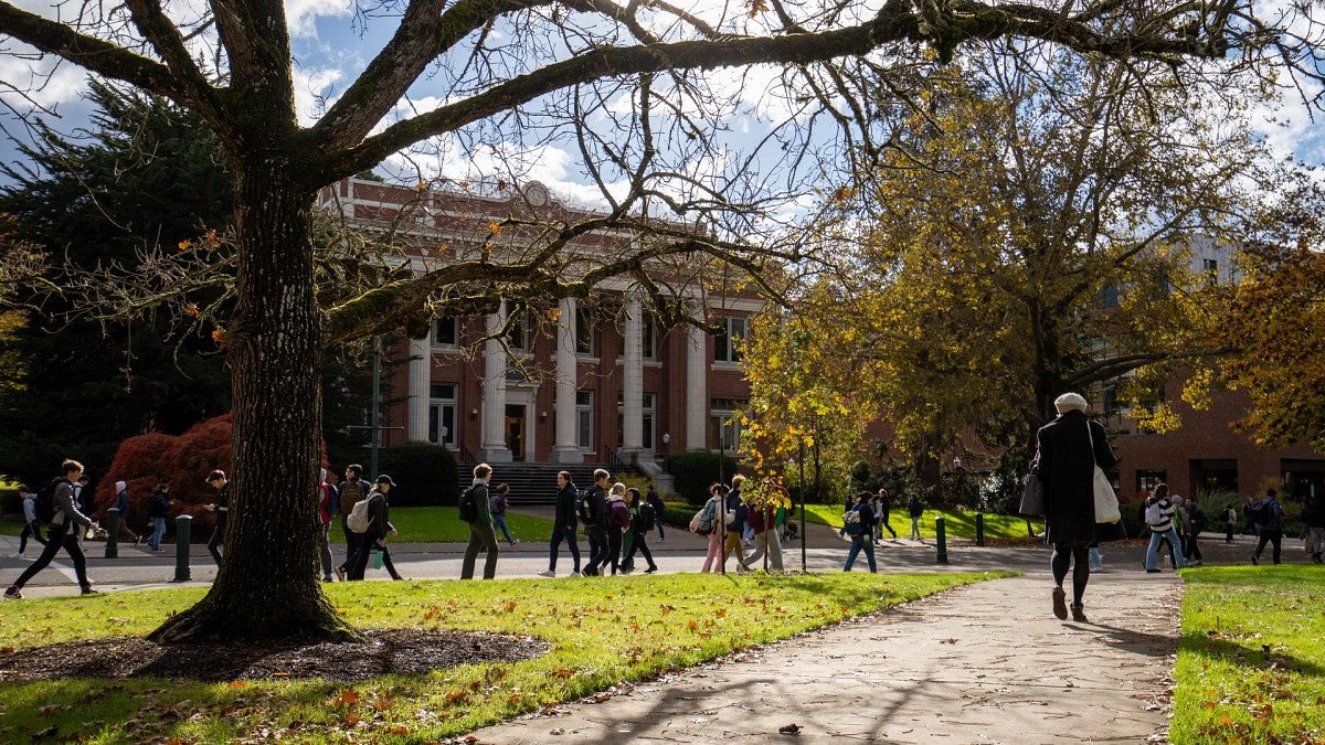 students walk in front of Johnson Hall