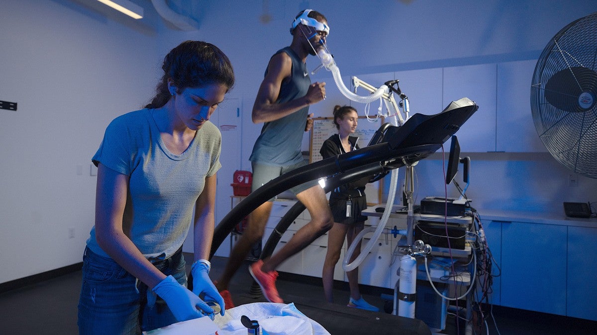 Researchers in the Bowerman Sports Science Center testing a man on a treadmill