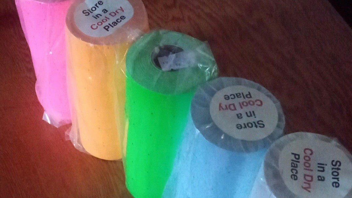 rolls of colored stickers at the surplus sale