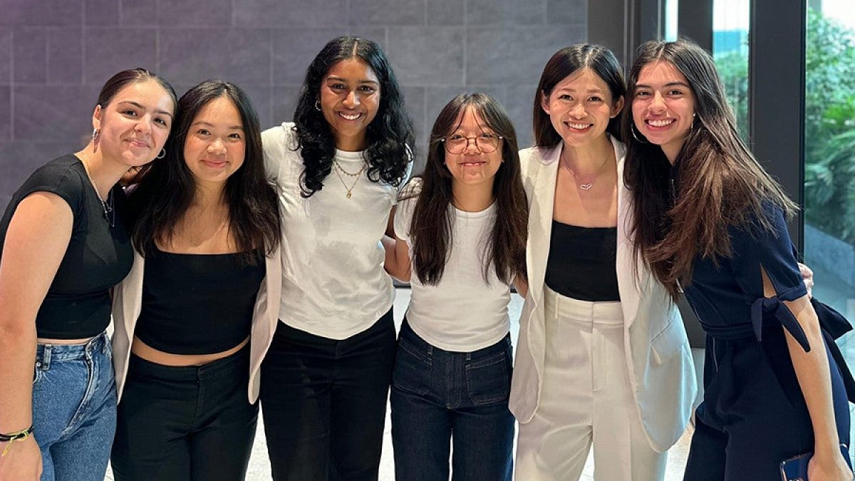 UO College of Education student Denise Akabey and five young women from her internship cohort.