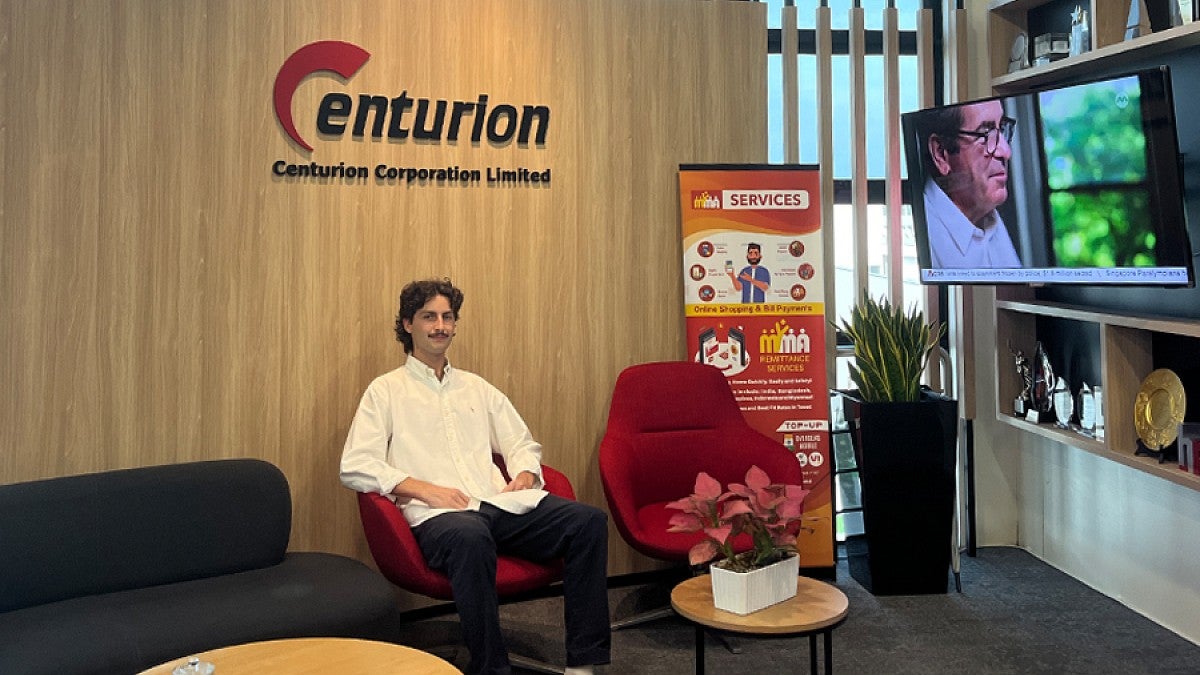 UO intern Spencer Erspamer sitting in the office of Centurion Corporation in Singapore.