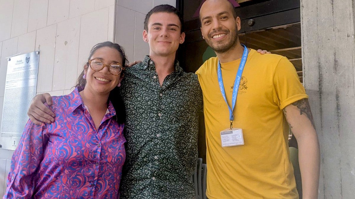 Charles Petrick standing with two colleagues, female and male, from Alcaldia de Medellin, Colombia 