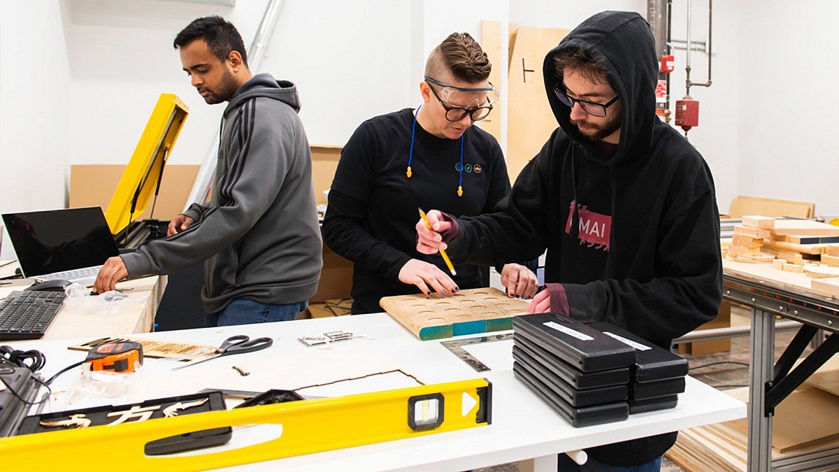 Teaching a student to use a laser engraving machine