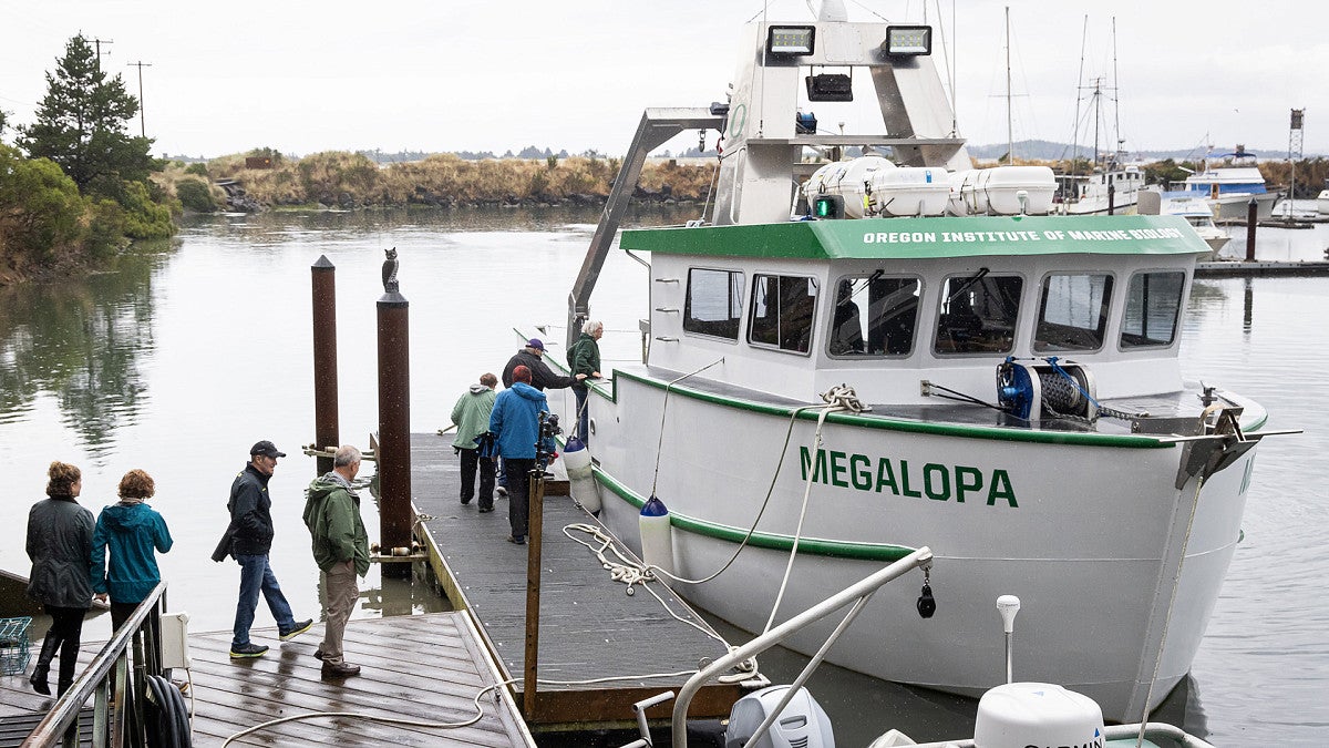 Students and researchers boarding the Research Vessel Megalopa