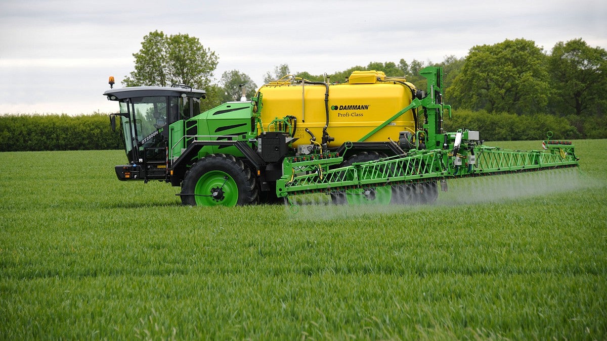 A large tractor spraying crops