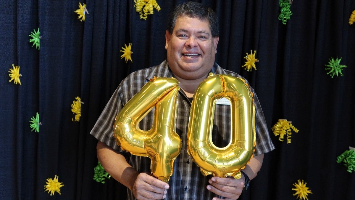 David Valdenegro holds "40" balloons