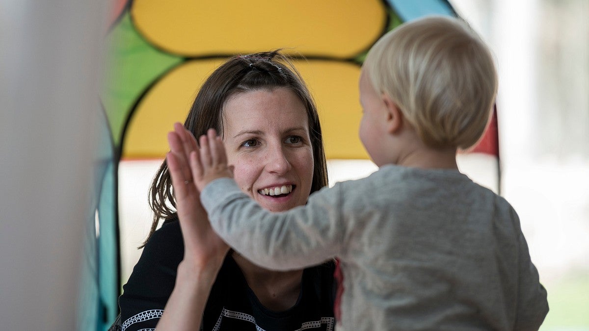 Mom giving child a high-five