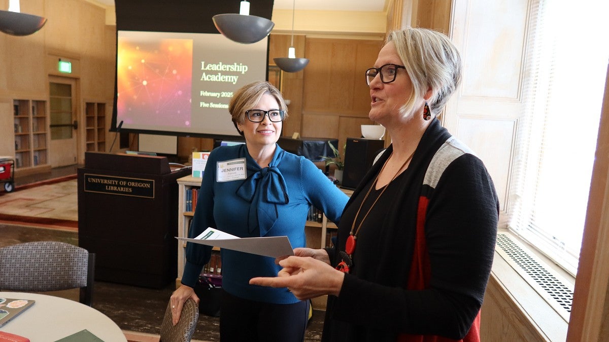 Jennifer Espinola (left) and Sierra Dawson, presenting at a recent meeting of the Leadership Academy, are equipping UO employees with the skills to create positive change and the confidence to act (credit: Matt Cooper, University Communications)