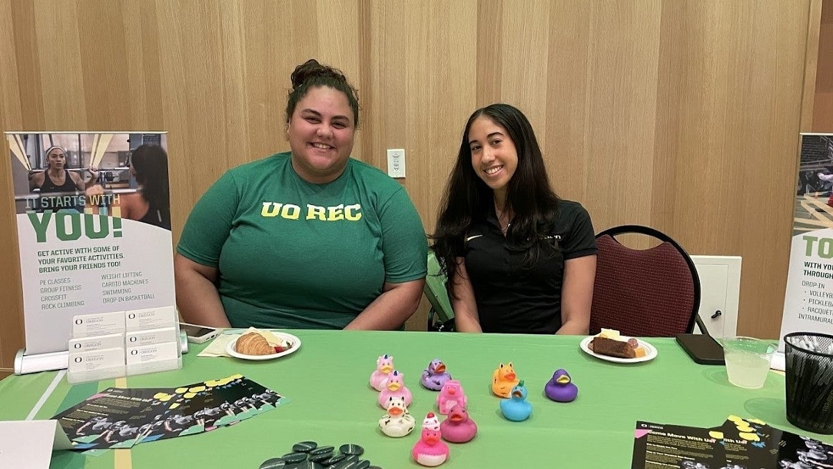 employees at rec center table at resource fair