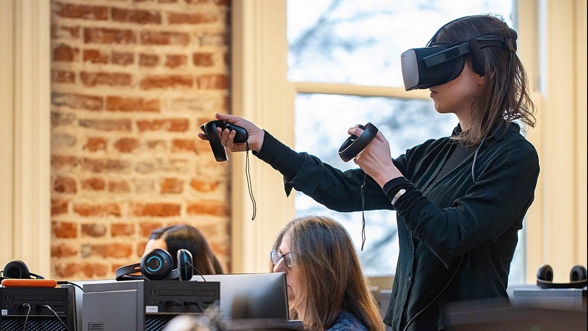 School of Journalism and Communications student using VR technology