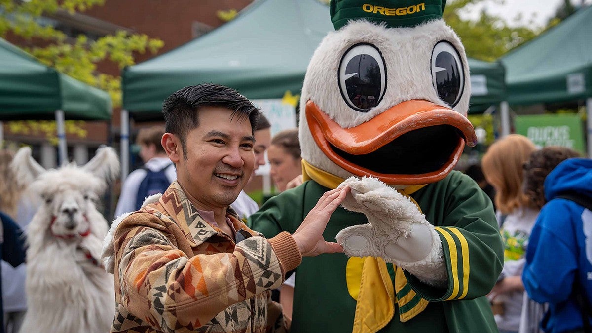 The Duck and a student throwing the O together