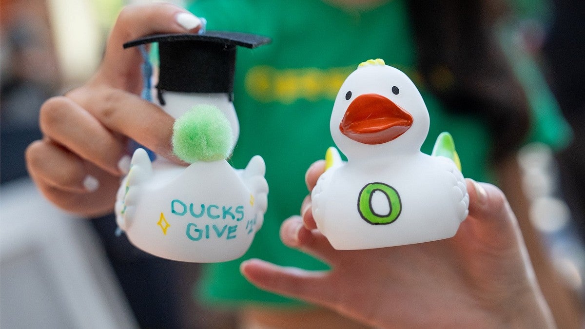 two white Ducks Give rubber ducks