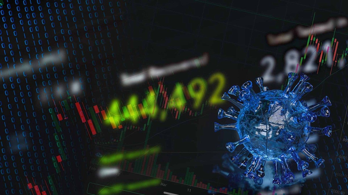 Computer screen with numbers and graphs with virus cells in front