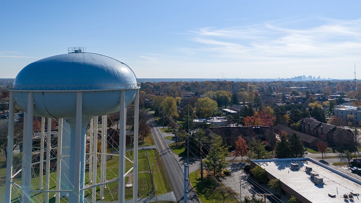 Water tower next to a small town