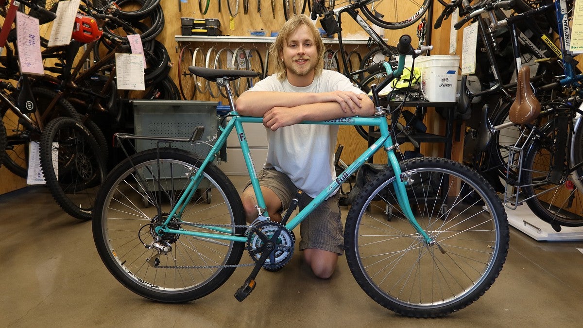 Senior Gavin Tycer, a bike mechanic with the Bike Program, restored this donated bike for the annual student bike sale this fall (photo: Matt Cooper, University Communications) 