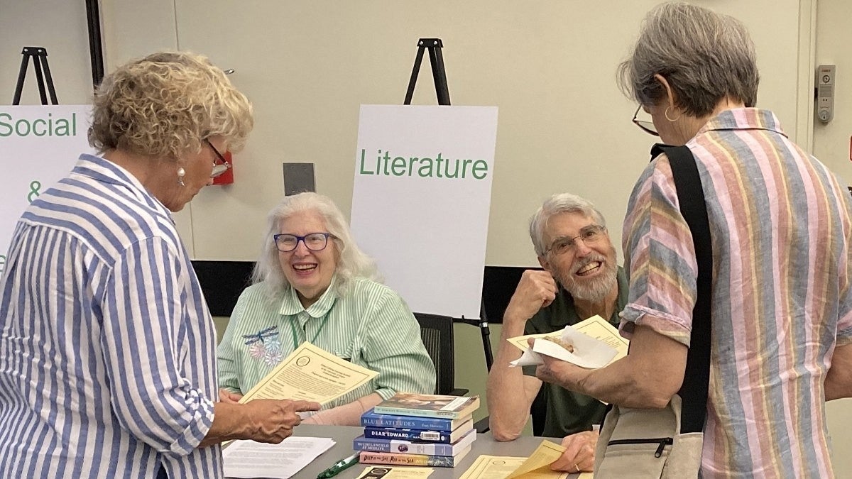 Osher Lifelong Learning Institute volunteers at table