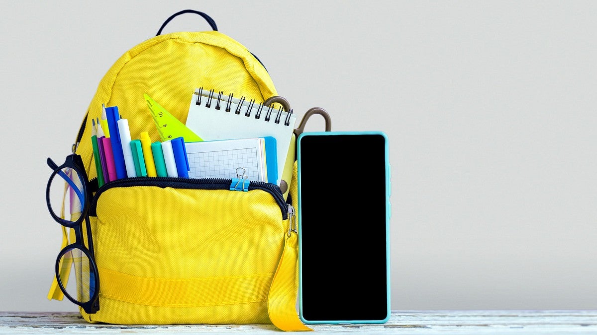 Child's school bag and a cellphone