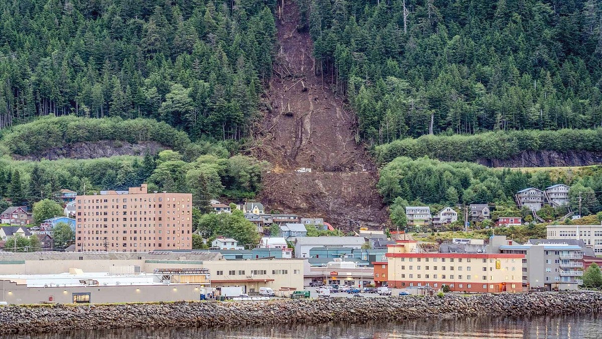 Landslide path down a hillside and into a town