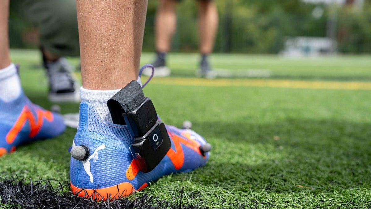 Prototype shoe with an attached sensor and refletive balls
