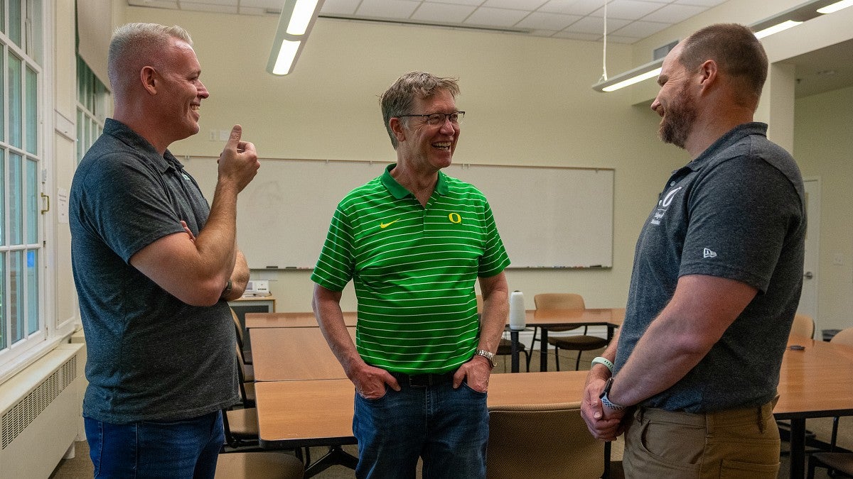 Robin Spoerl, Bob Mighell and Kent McIntosh share a laugh