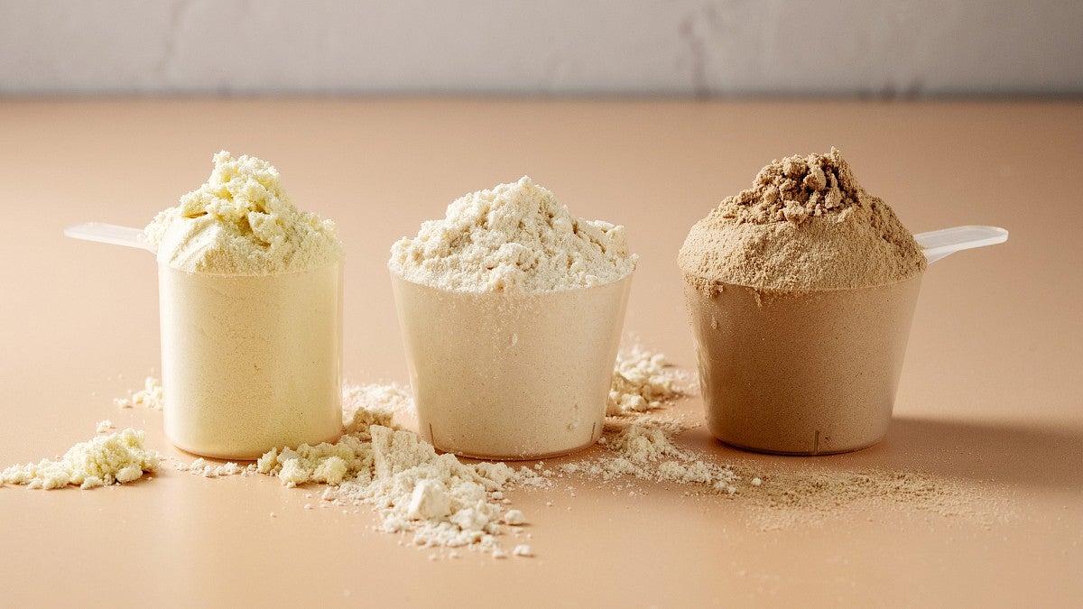 Three scoops of different protein powders