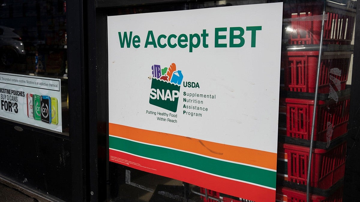 Sign in store window of business that accepts SNAP cards