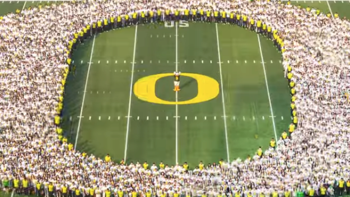New students gathered in the shape of the O on football field 