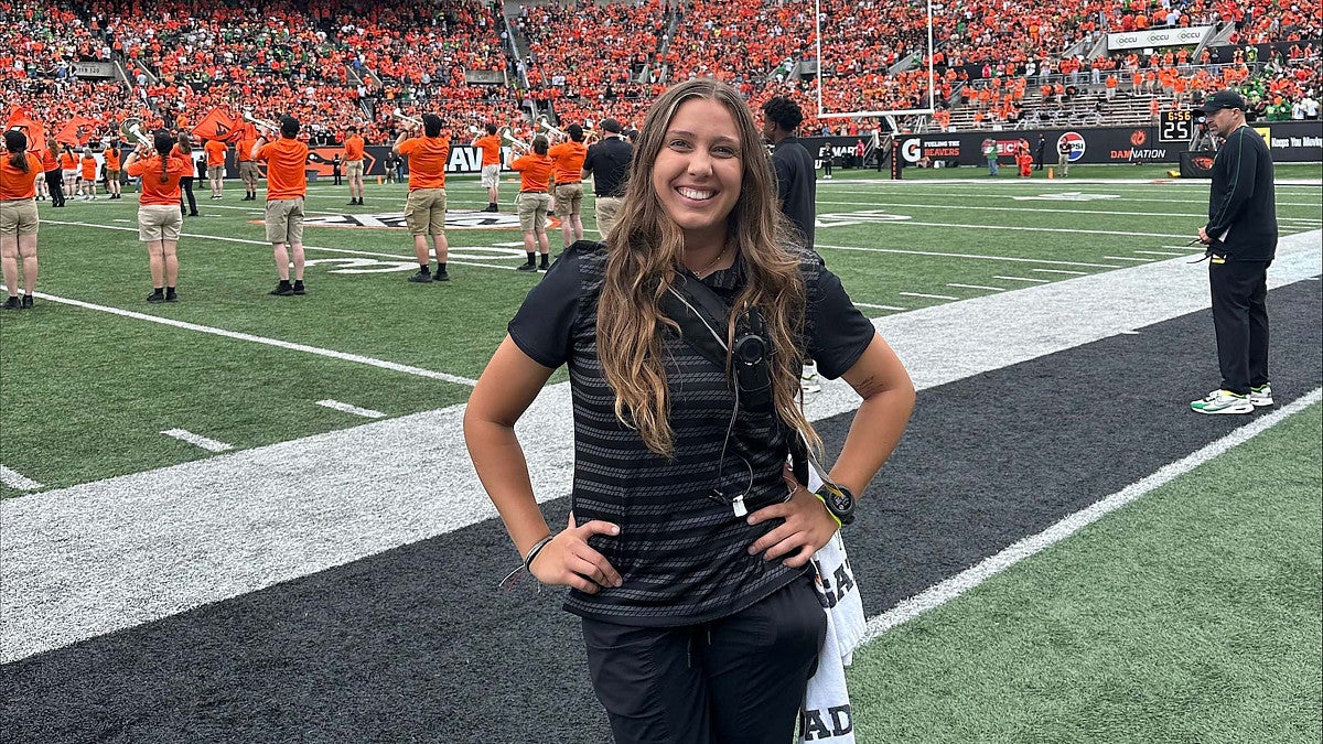 Ally Smith on the sidelines of a football game at Reser Stadium in Corvallis