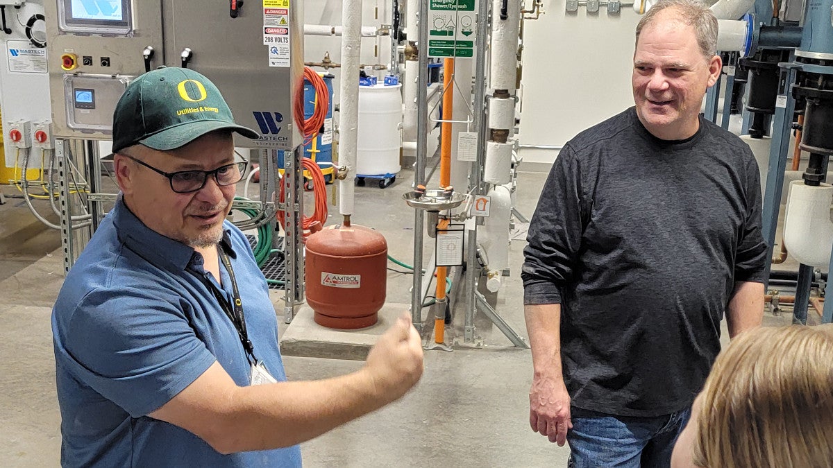Rick Tabor (left) and Paul Langley, associate directors with Utilities and Energy, team up with roughly 25 people each August for a daylong test of the UO’s power-generation capability