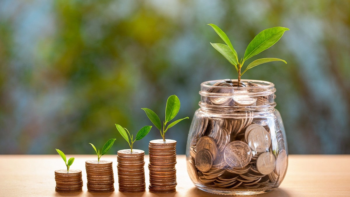 savings growth coins in jar