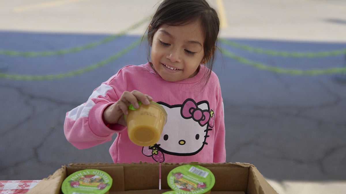 child with applesauce