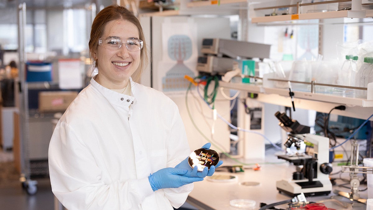 Emma Jacobs holding a silicon wafer