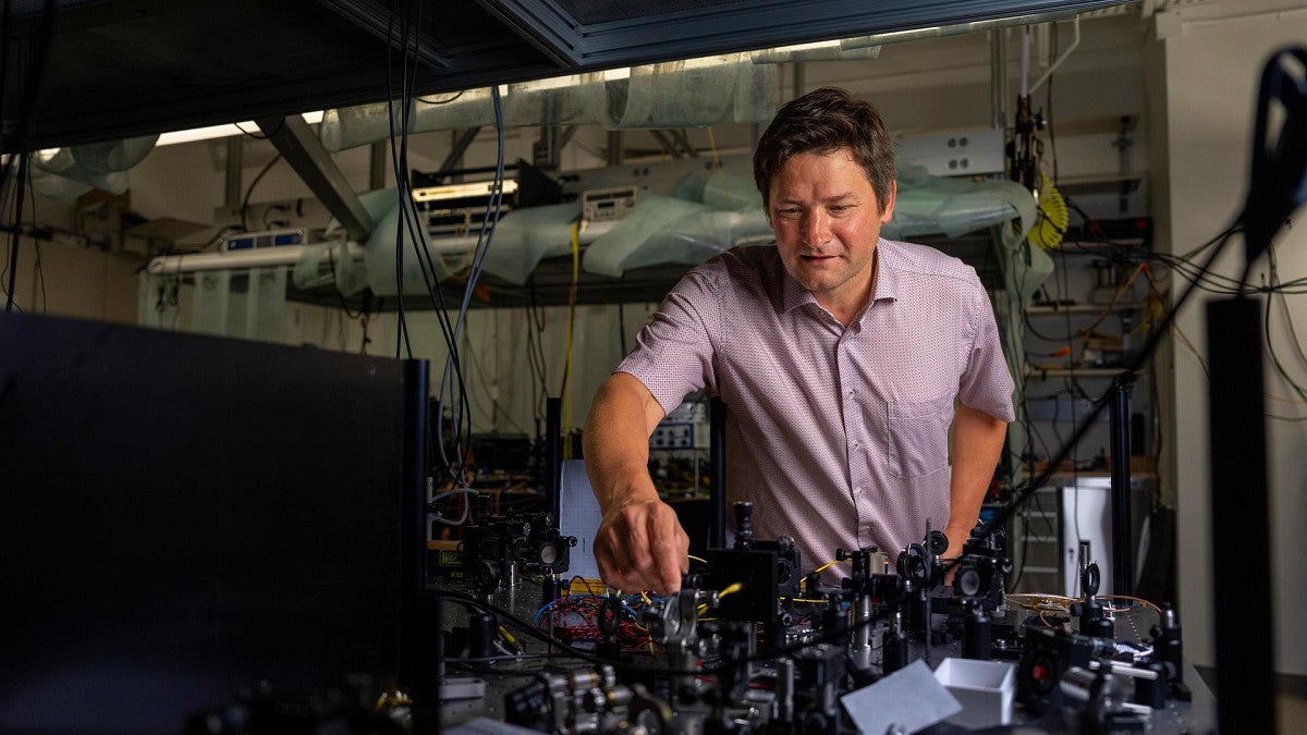 Brian Smith examines a network in his lab